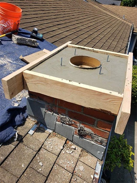 Chimney Repair on a hot summer day in Belmont