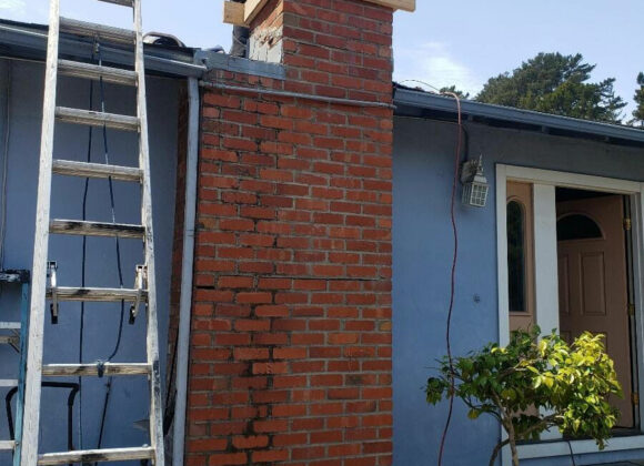 a ladder up to a roof and worker providing a Chimney Repair in Hayward, Palo Alto, San Francisco, Mountain View, Fremont, Redwood City